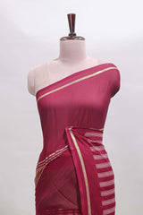Green zari motifs semi soft silk saree with contrast border and striped pallu