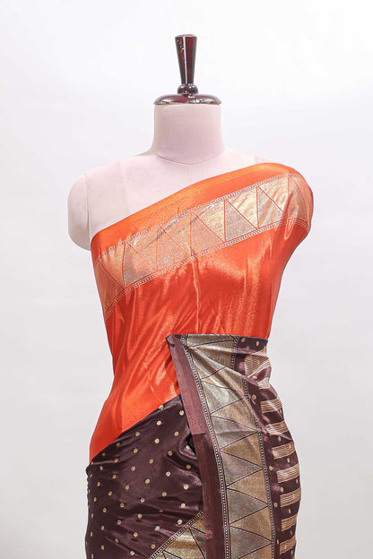 Orange & brown dual shade zari motifs semi soft silk saree with self border and striped pallu