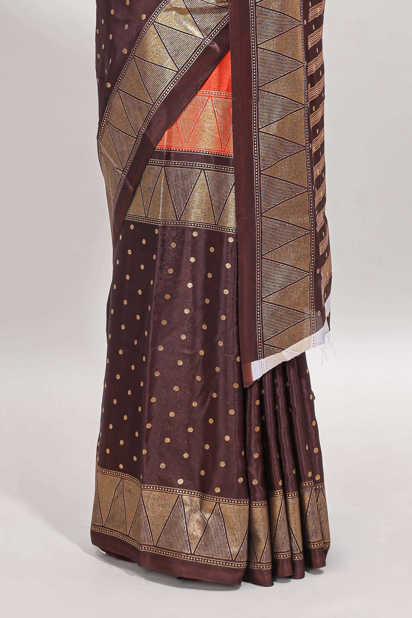 Orange & brown dual shade zari motifs semi soft silk saree with self border and striped pallu