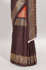 Orange & brown dual shade zari motifs semi soft silk saree with self border and striped pallu
