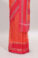 Orange checked semi soft silk saree with contrast border and striped pallu