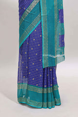 Royal blue checked semi soft silk saree with contrast border and striped pallu