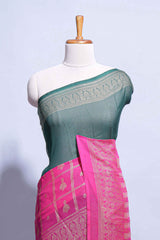 Dark green color budget silk saree with contrast foil print border and contrast pallu along with contrast blouse piece