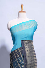 Blue color budget silk saree with contrast foil print border and contrast pallu along with contrast blouse piece
