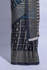 Blue color budget silk saree with contrast foil print border and contrast pallu along with contrast blouse piece