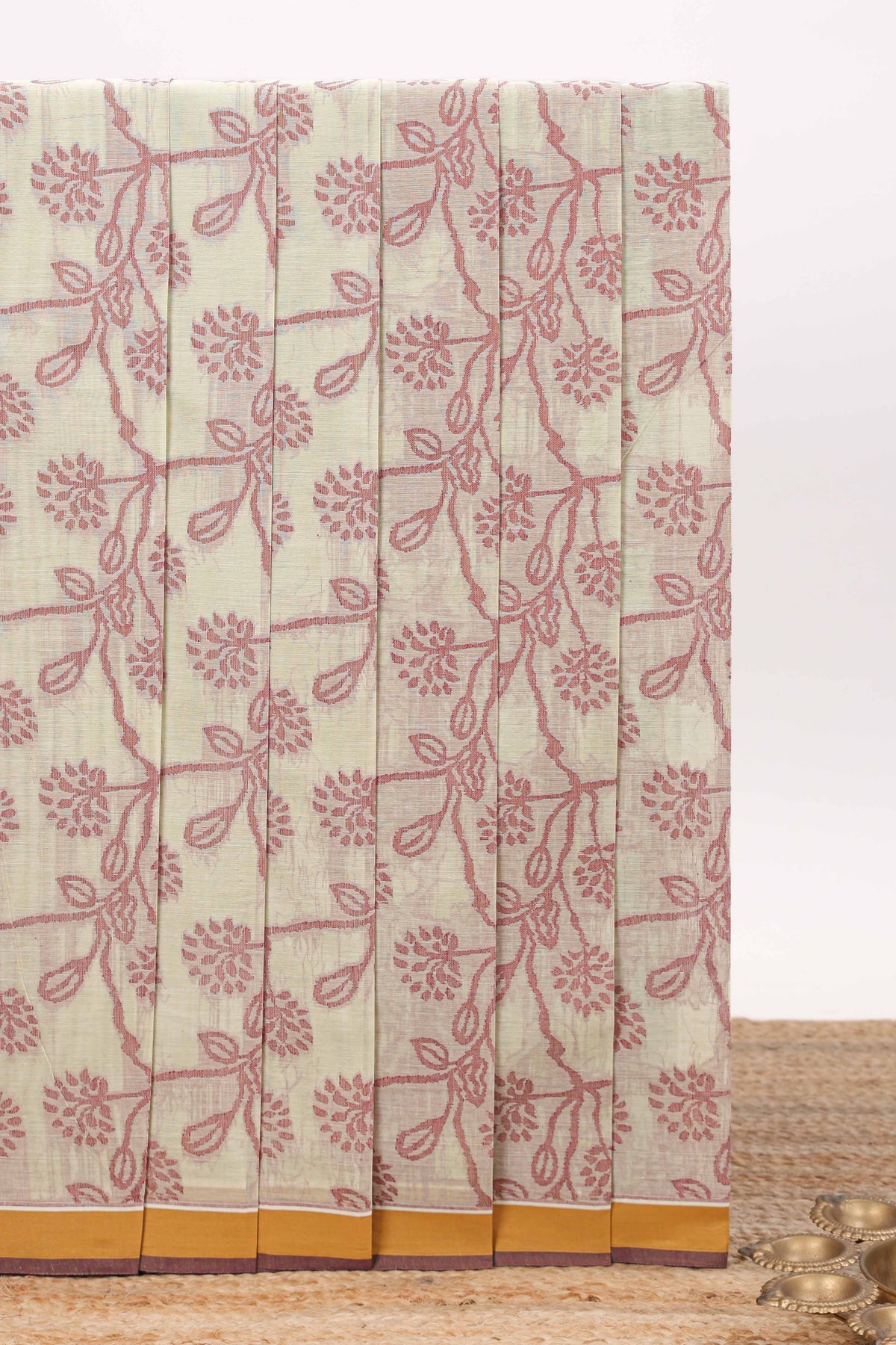 Cream color floral designed chirala cotton saree with contrast border and matching blouse