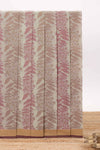 Beige floral designed chirala cotton saree with contrast border and self tree motif pallu