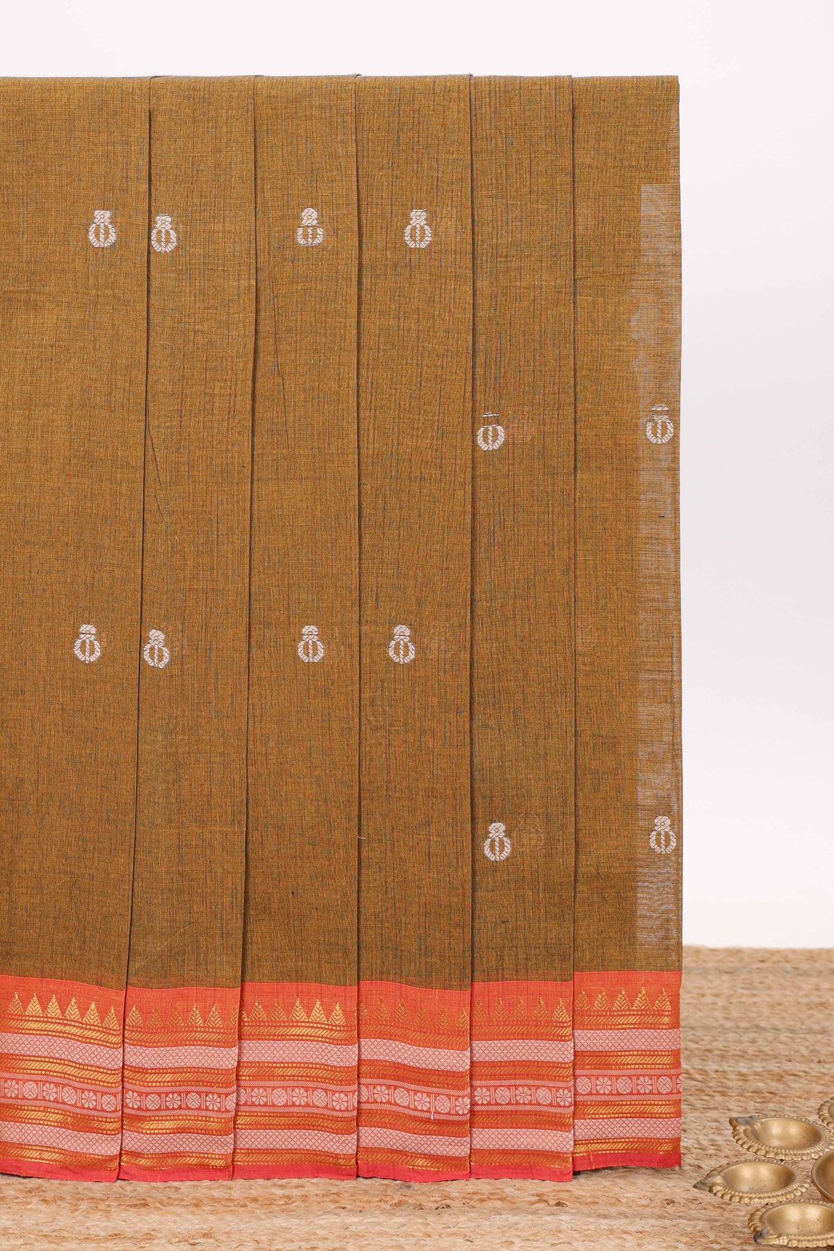 Mustard brown butta designed chirala cotton saree with contrast border and blouse