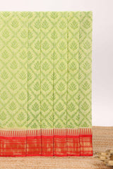 Green geometric floral design chirala cotton saree with contrast border and zari design pallu