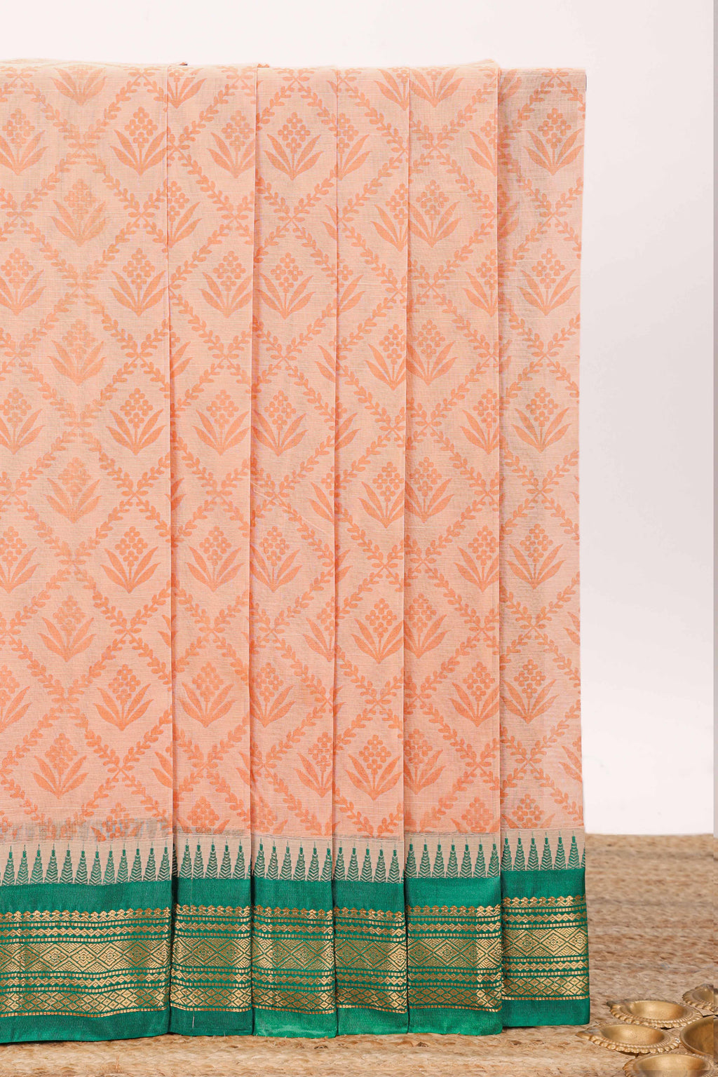 Peach geometric floral design chirala cotton saree with contrast border and zari design pallu