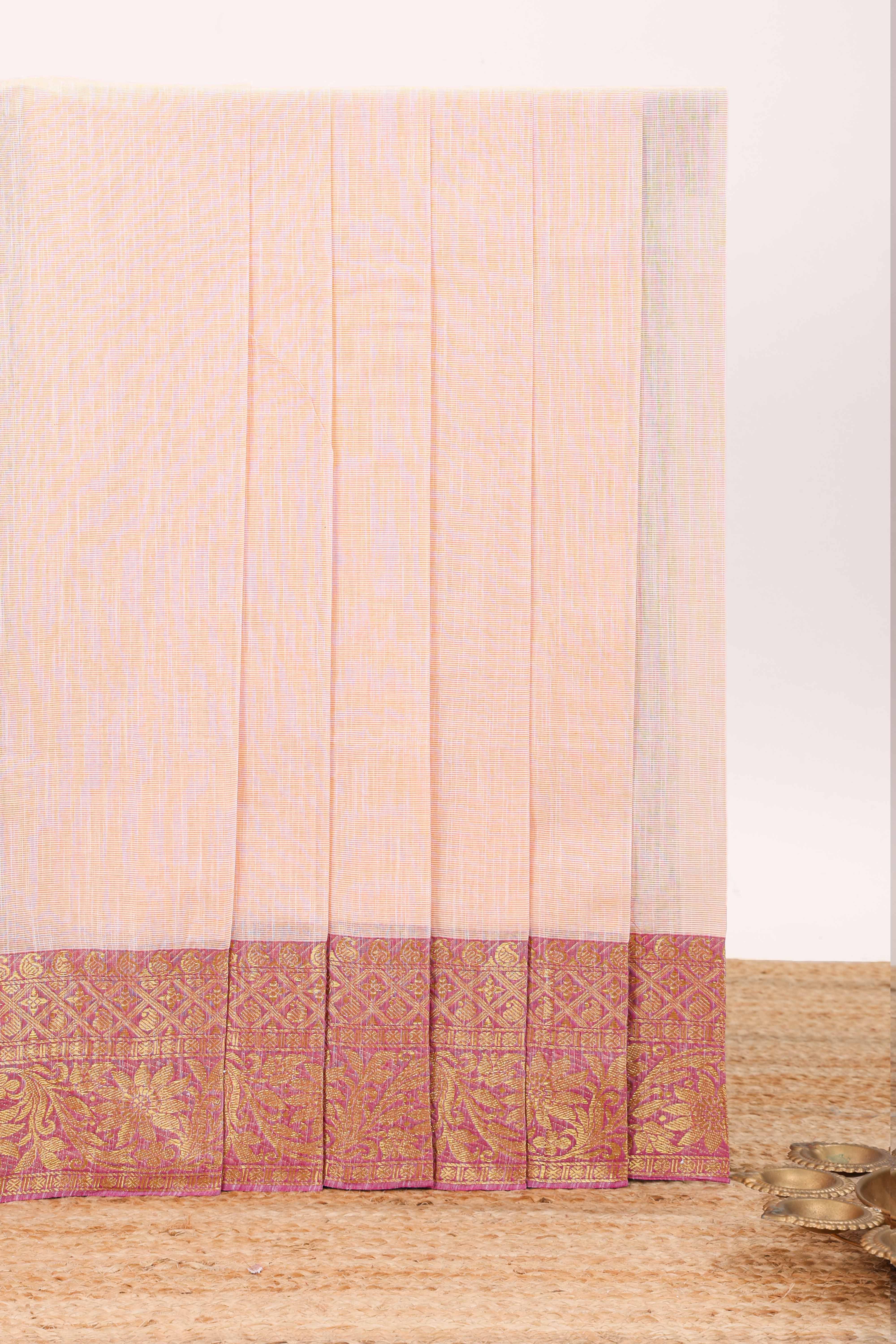 Pale peach plain design chirala cotton saree with contrast border and striped design pallu