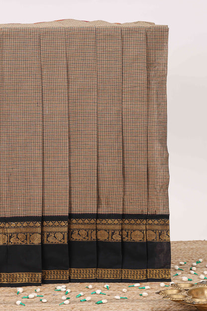 Brown small checked chettinad cotton saree with contrast zari bentex border and striped pallu