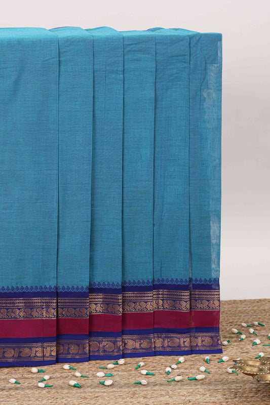 Blue plain chettinad cotton saree with contrast zari border and stripe pallu