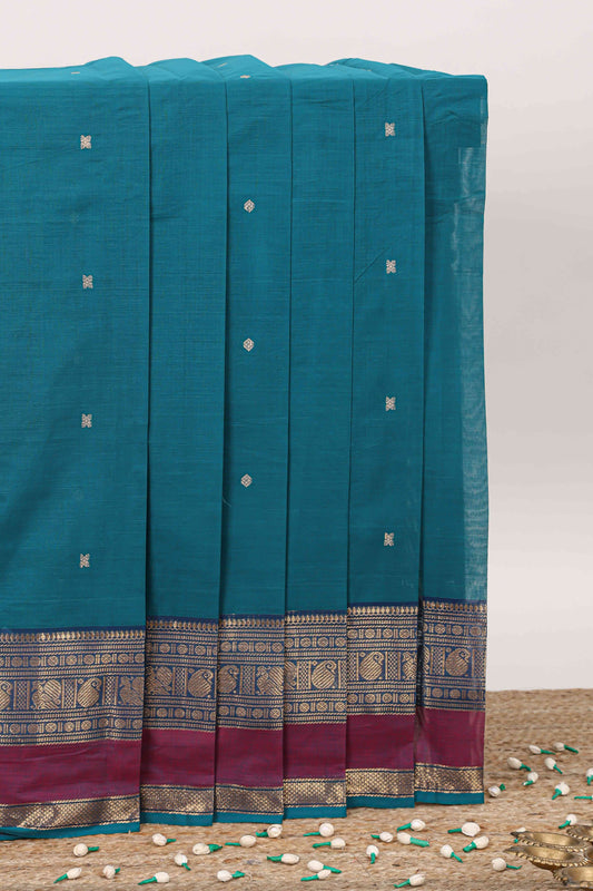 Peacock green plain chettinad cotton saree with contrast zari border and stripe pallu