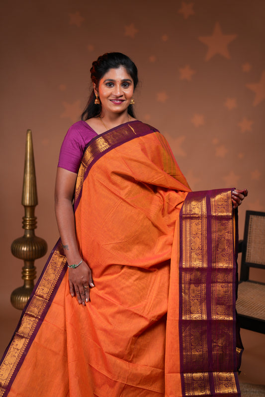 Orange plain chettinad cotton saree with contrast bentex zari border and striped pallu