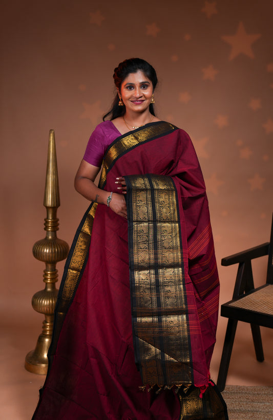 Red plain chettinad cotton saree with contrast bentex zari border and striped pallu