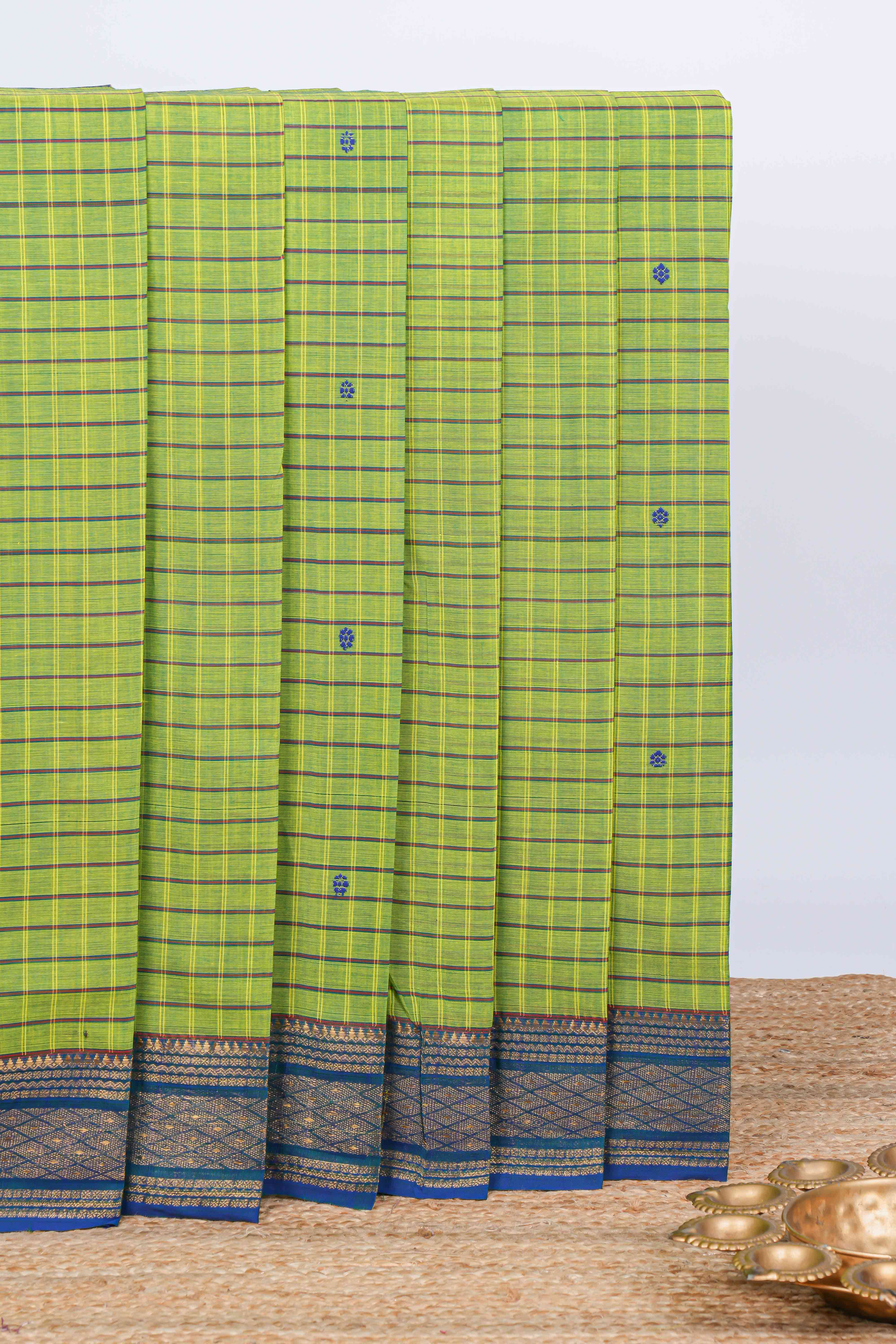 Green checked floral motifs chettinad cotton saree with contrast border and matching blouse