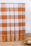 Burnt orange and white checked zari motifs chettinad cotton saree with self zari border and matching pallu