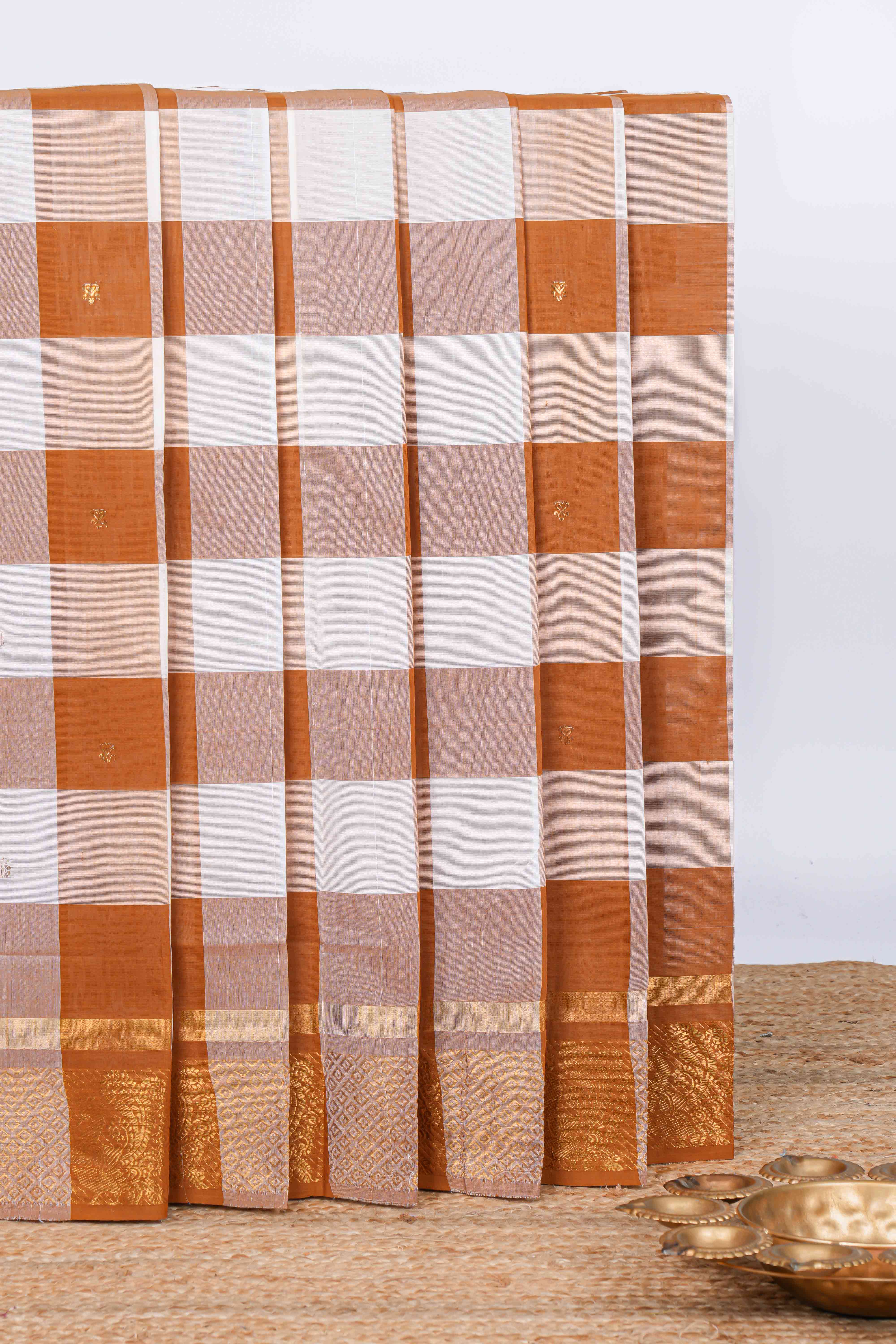 Burnt orange and white checked zari motifs chettinad cotton saree with self zari border and matching pallu