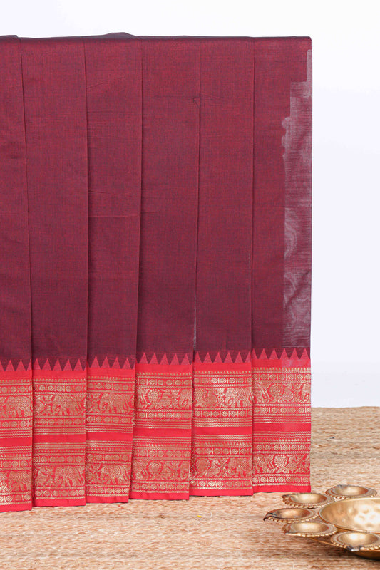 Maroon plain chettinad cotton saree with contrast zari border and matching striped pallu