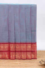 Powder blue plain chettinad cotton saree with contrast checked border and matching blouse