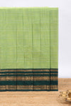 Green plain chettinad cotton saree with contrast zari border and matching blouse