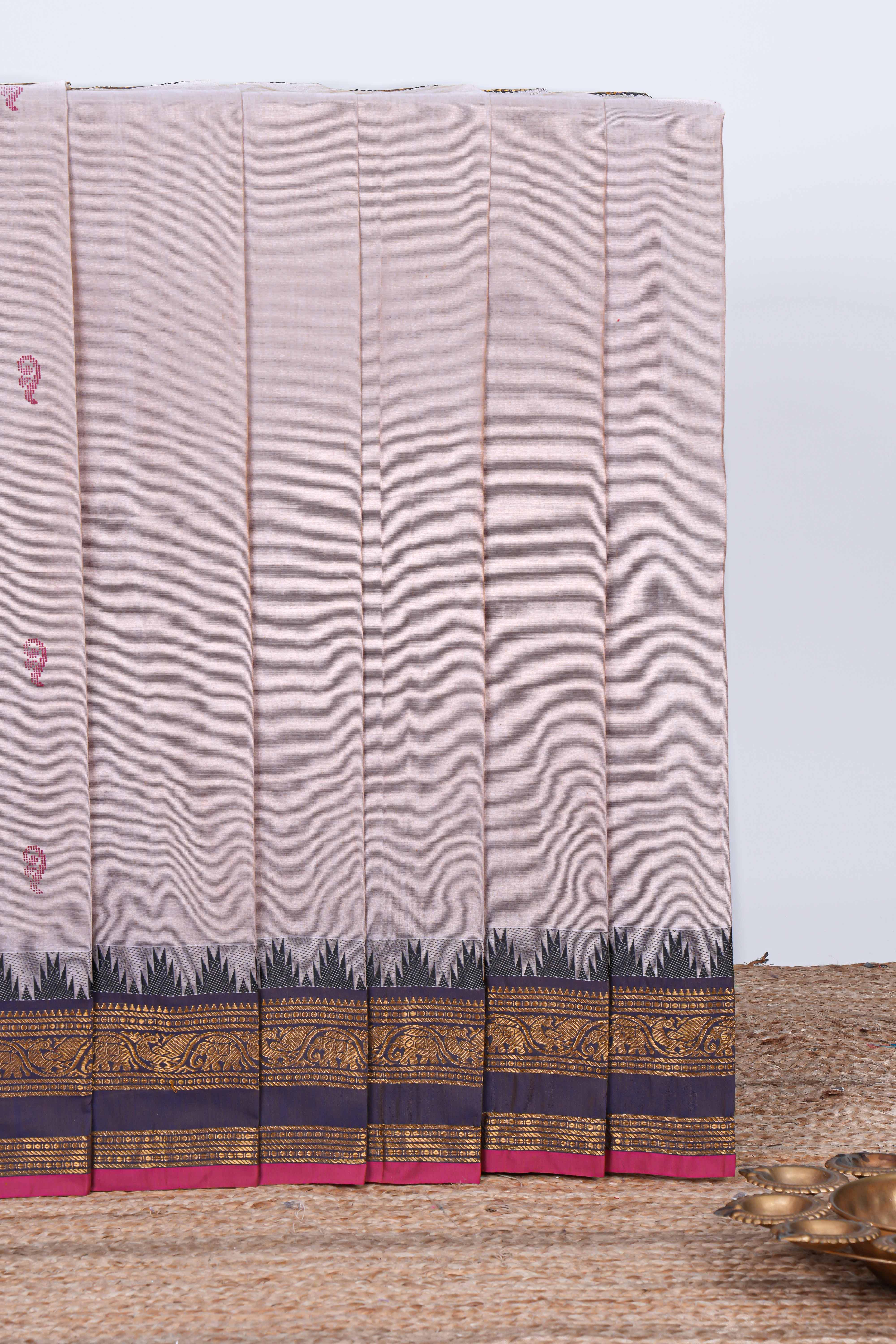 Oyster pink plain chettinad cotton saree with contrast zari border and matching striped pallu