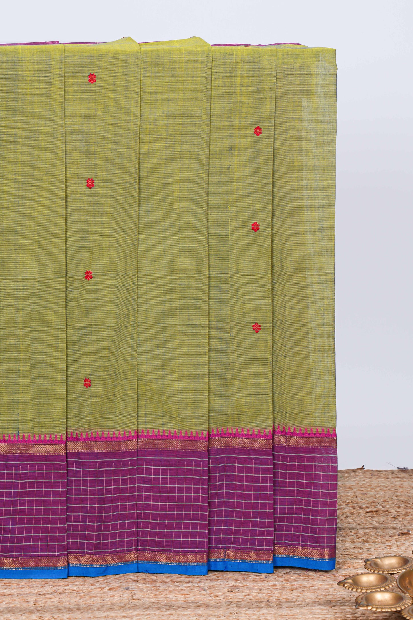 Green floral motifs chettinad cotton saree with contrast checked border and matching striped pallu