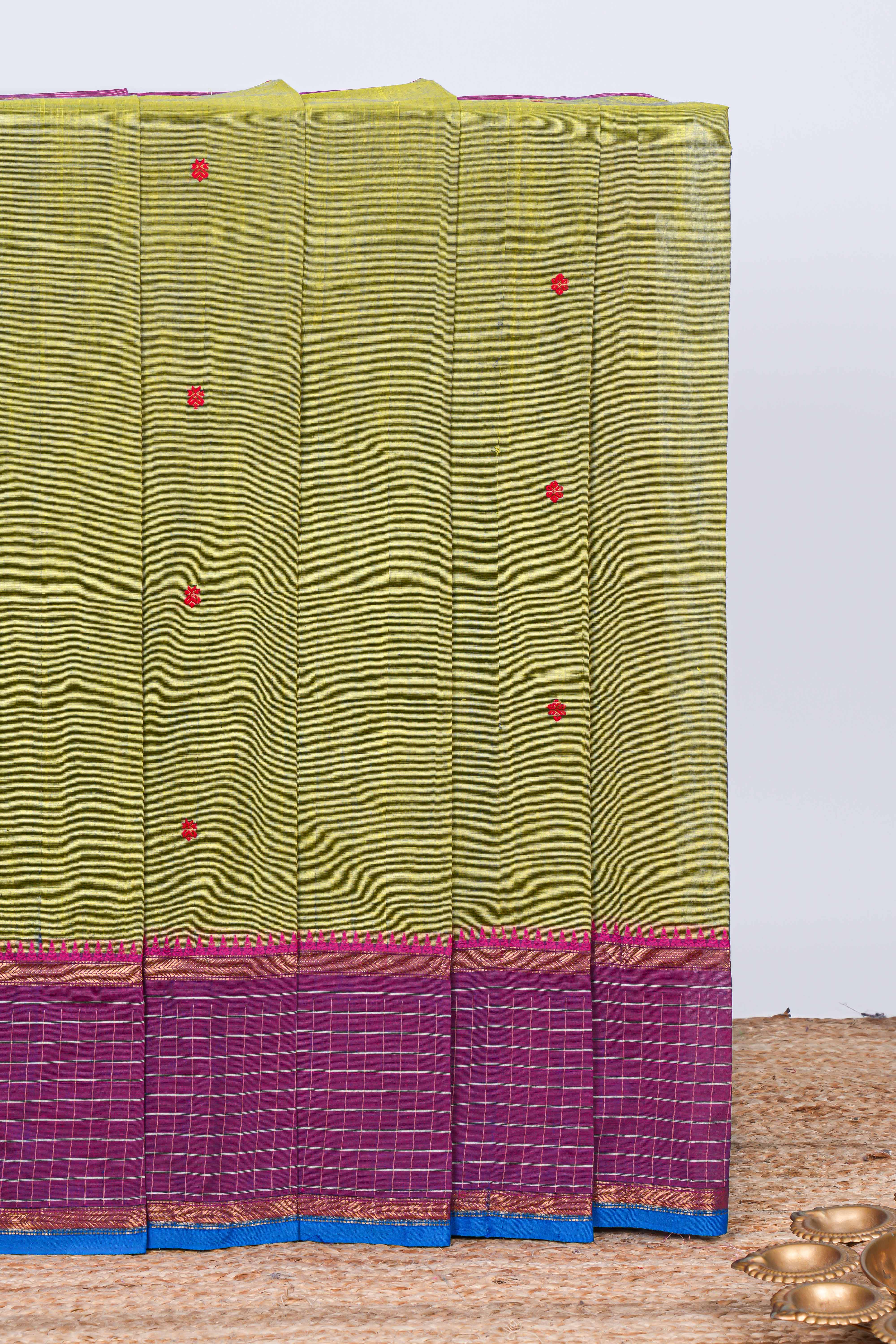 Green floral motifs chettinad cotton saree with contrast checked border and matching striped pallu
