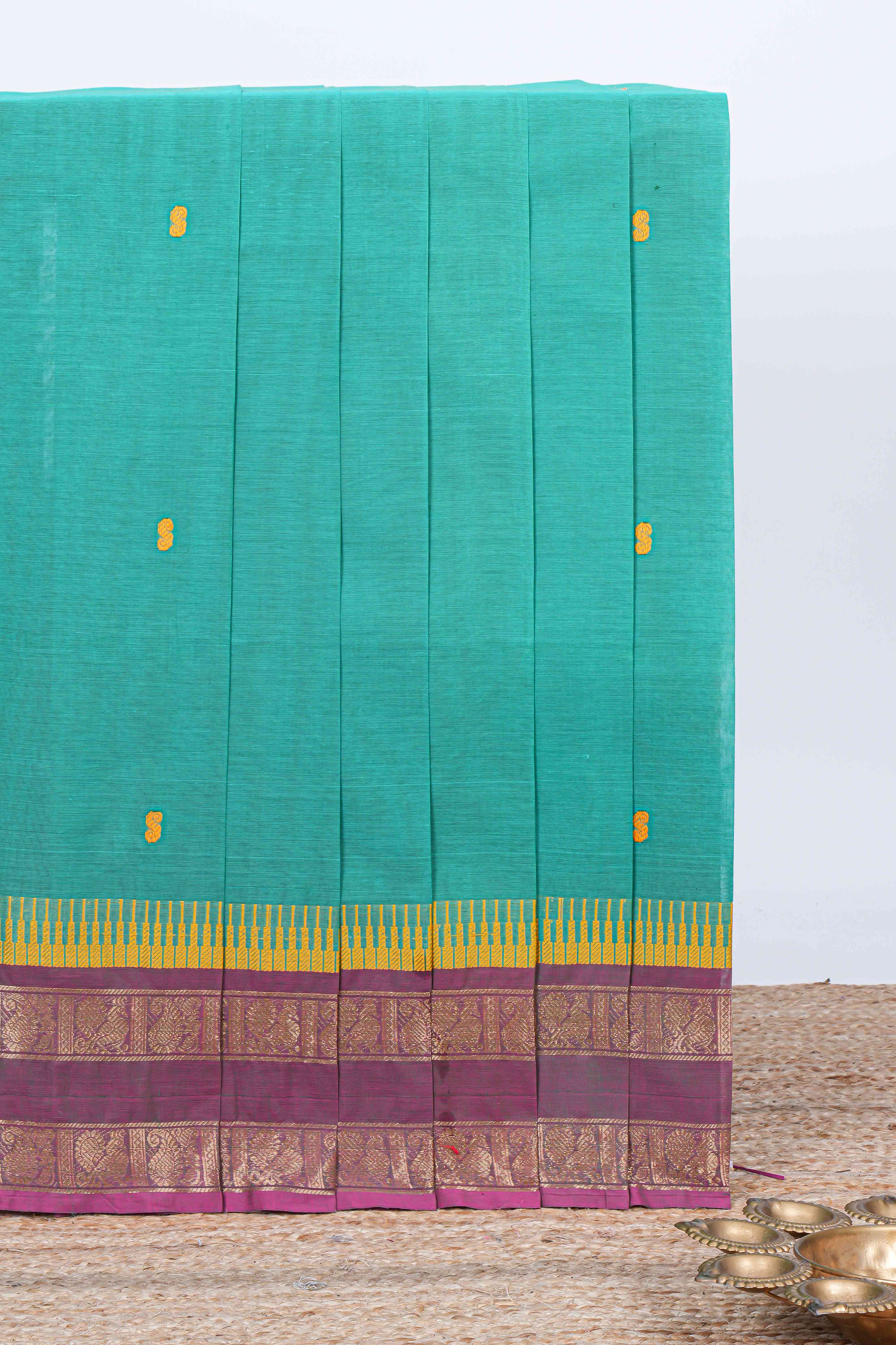 Turquoise green thread butta chettinad cotton saree with contrast border and matching striped pallu