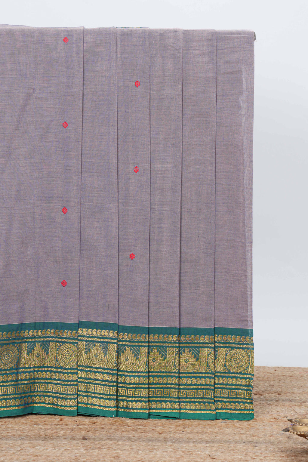 Grey colour chettinad cotton saree all over thread butta with contrast border and matching pallu along with blouse