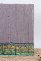 Grey colour chettinad cotton saree all over thread butta with contrast border and matching pallu along with blouse