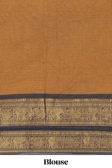 Deep Mustard yellow Chettinad cotton saree with a plain body antique gold zari elephant border along with matching blouse