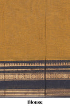 Deep Mustard yellow Chettinad cotton saree with a plain body and a contrasting black border by antique gold zari motifs along with blouse piece
