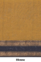 Deep Mustard Brown Chettinad cotton saree with a plain body and a contrasting black border by intricate antique gold zari motifs along with blouse piece