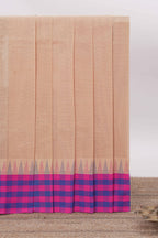 Light Peach Chettinad cotton saree with a plain body contrasting pink and royal blue checked border and classic temple motif detailing along with matching blouse