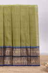Olive green plain chettinad cotton saree with contrast bentex zari border and matching blouse