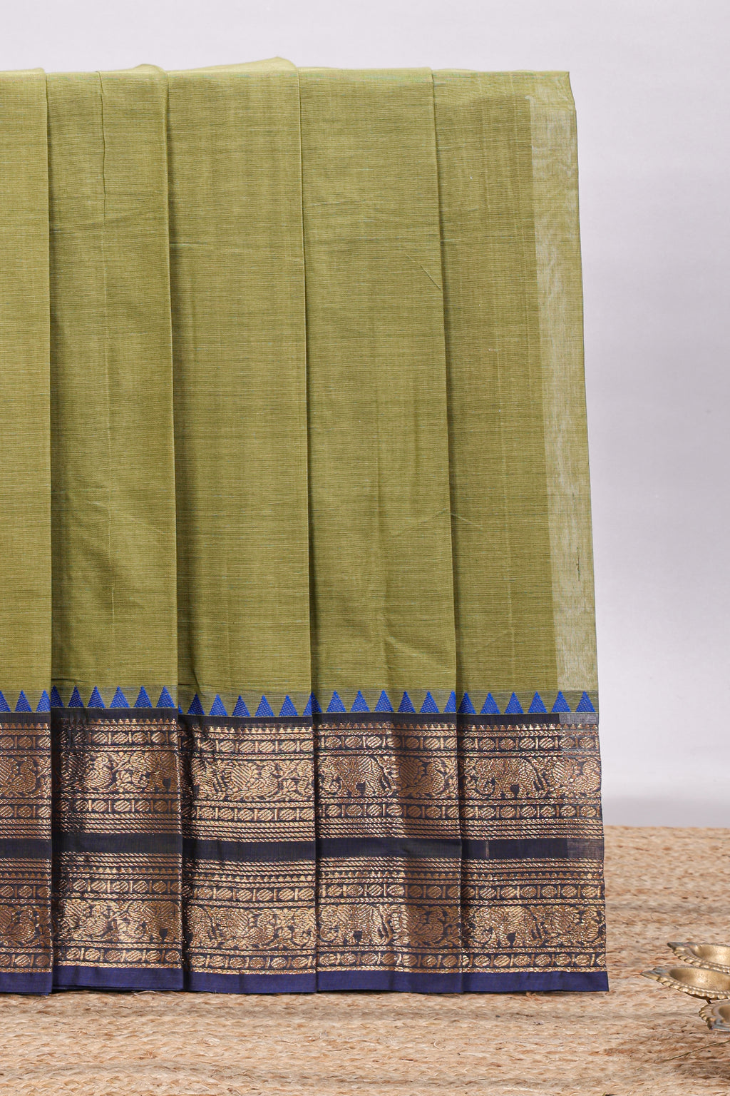 Olive green plain chettinad cotton saree with contrast bentex zari border and matching blouse