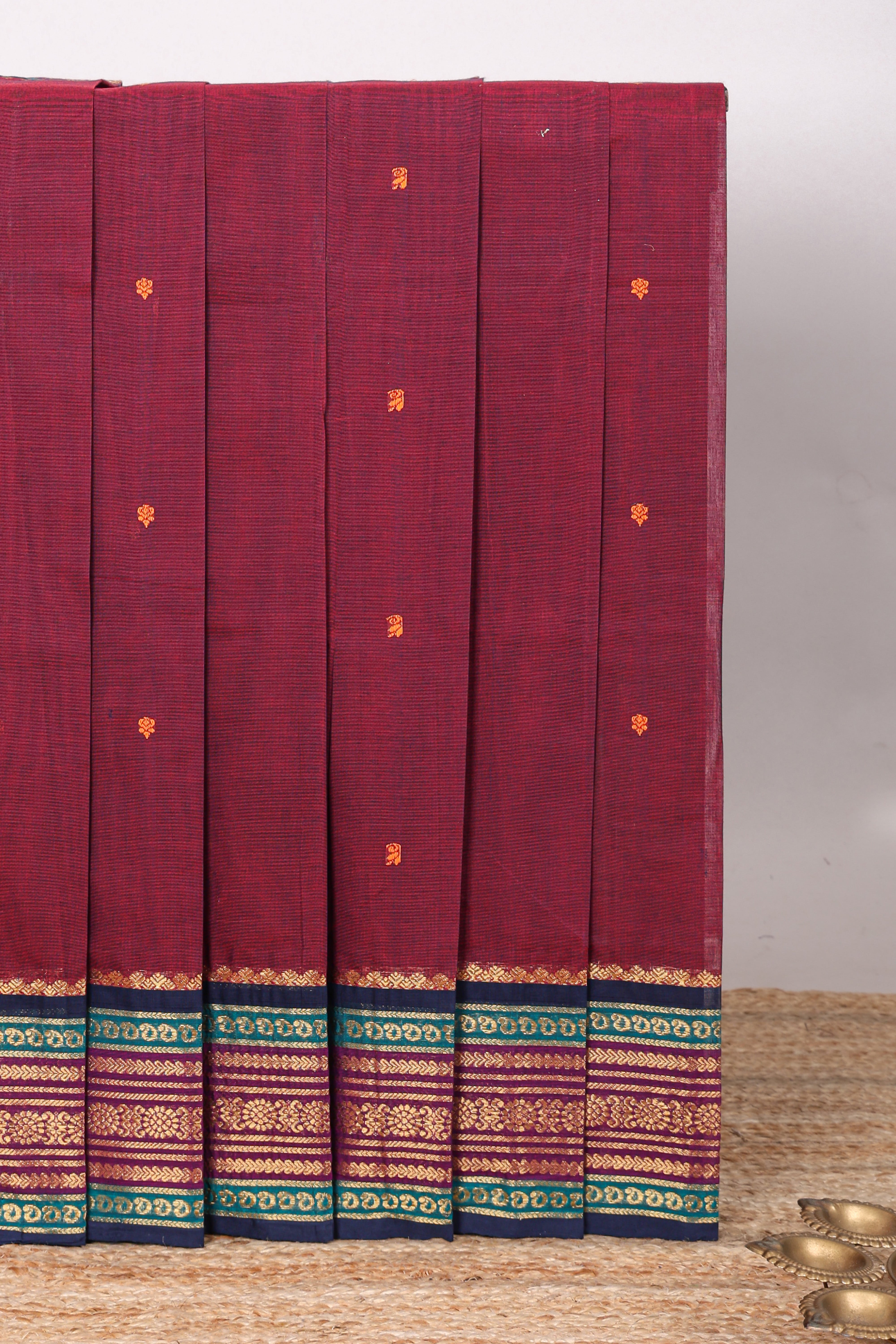 Maroon floral motifs chettinad cotton saree with contrast zari border and matching blouse