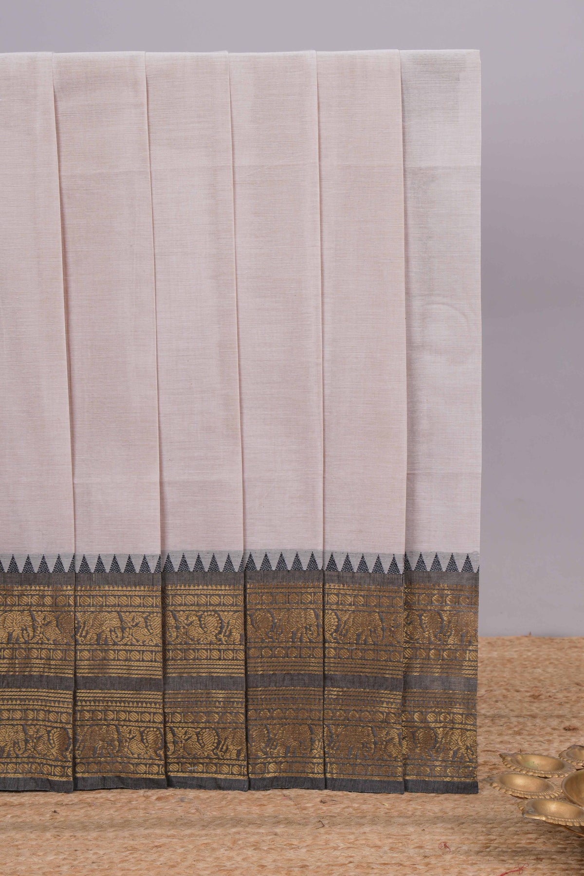 Grey plain chettinad cotton saree with contrast zari border and matching blouse