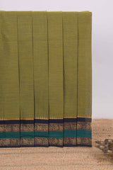 Green plain chettinad cotton saree with contrast zari border and matching blouse