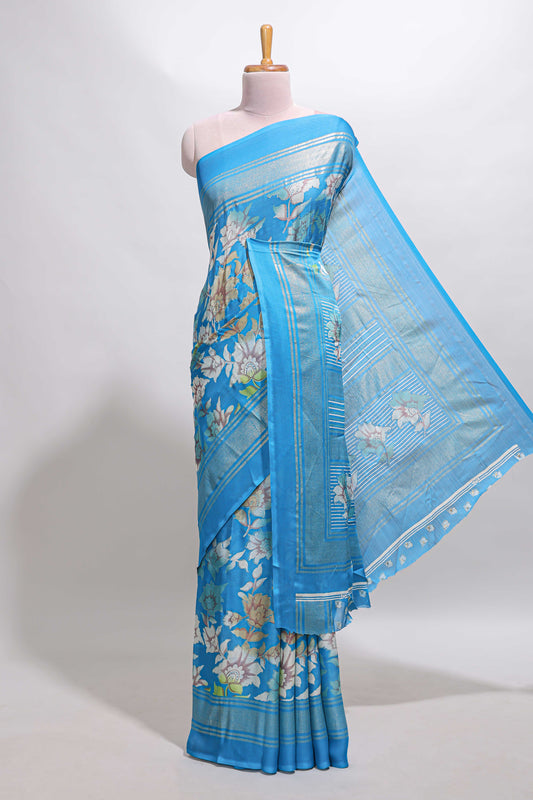 Sky blue floral design chiffon saree with self border and matching blouse