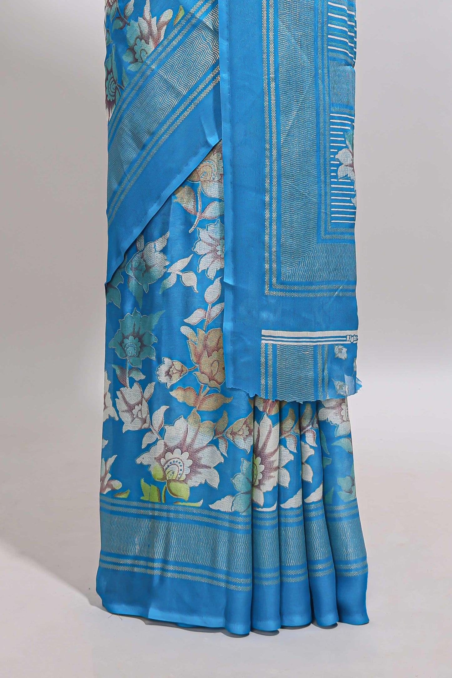 Sky blue floral design chiffon saree with self border and matching blouse