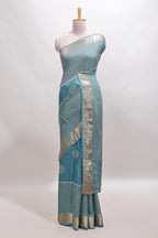 Turquoise blue checked floral motifs chiffon saree with self zari border and contrast blouse