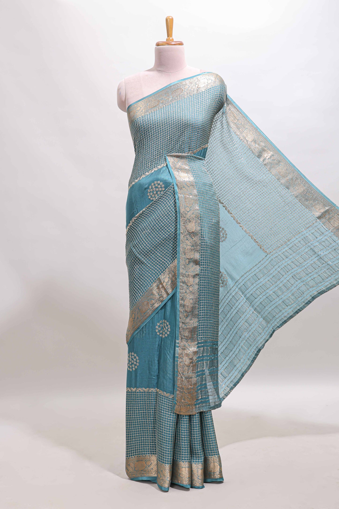 Turquoise blue checked floral motifs chiffon saree with self zari border and contrast blouse