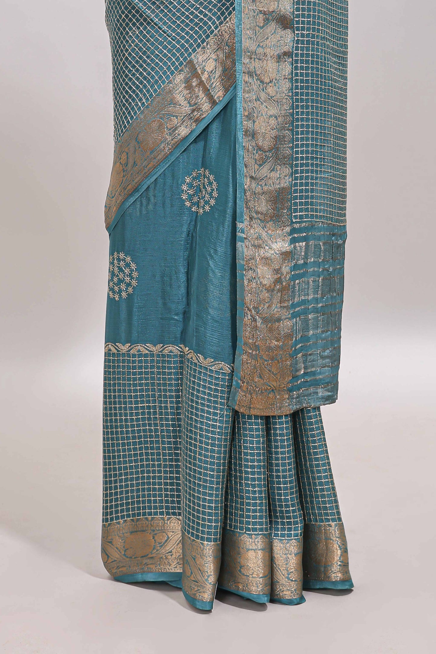 Turquoise blue checked floral motifs chiffon saree with self zari border and contrast blouse
