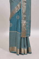 Turquoise blue checked floral motifs chiffon saree with self zari border and contrast blouse