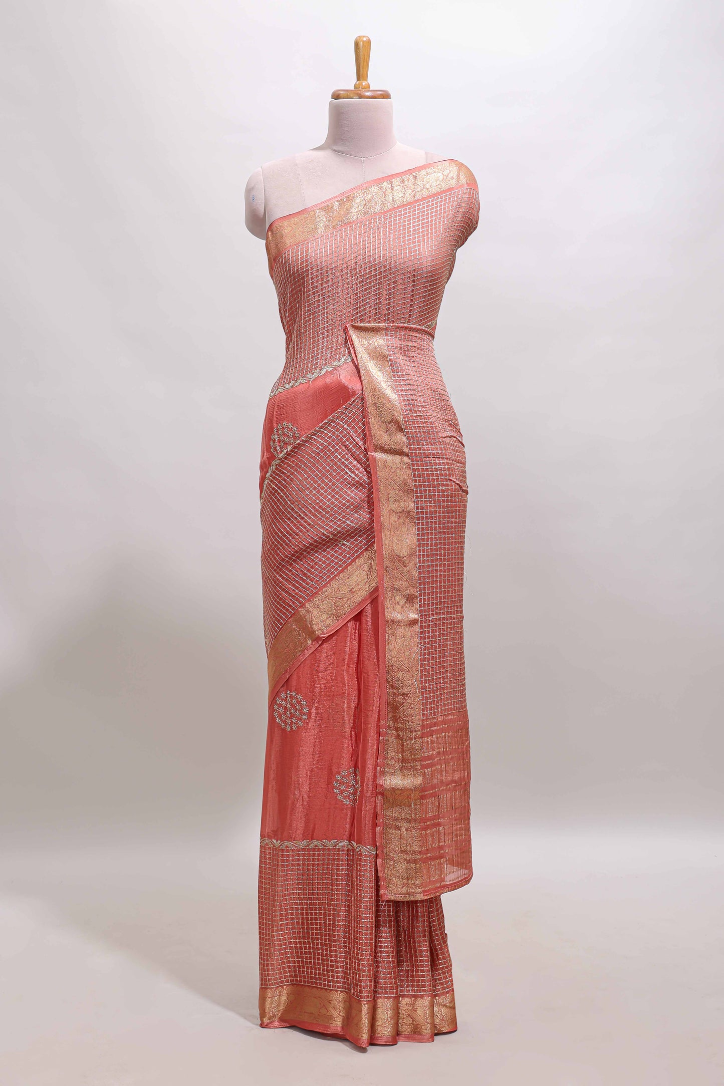 Peach checked floral motifs chiffon saree with self zari border and contrast blouse