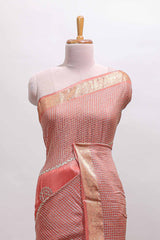 Peach checked floral motifs chiffon saree with self zari border and contrast blouse