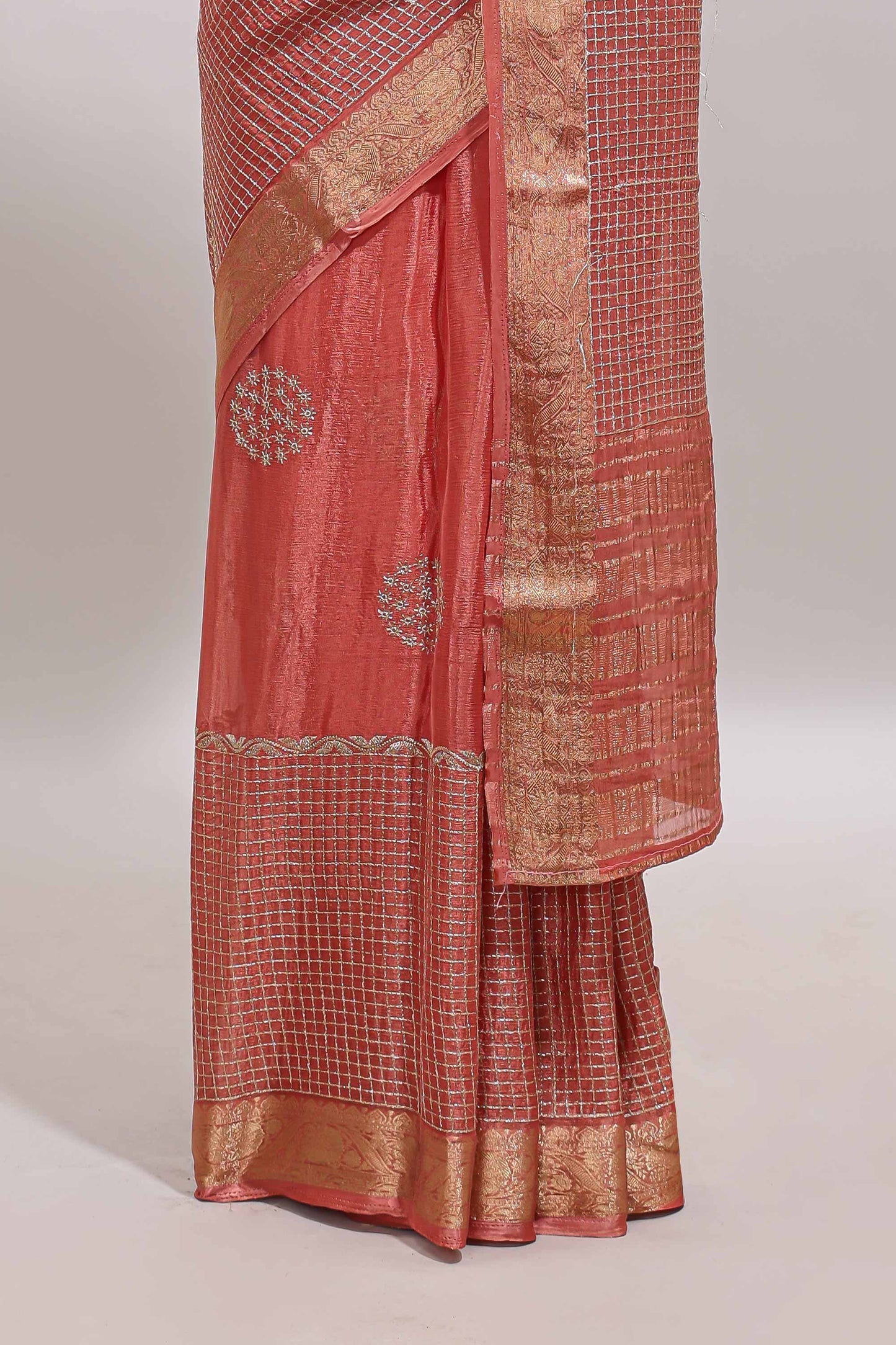 Peach checked floral motifs chiffon saree with self zari border and contrast blouse